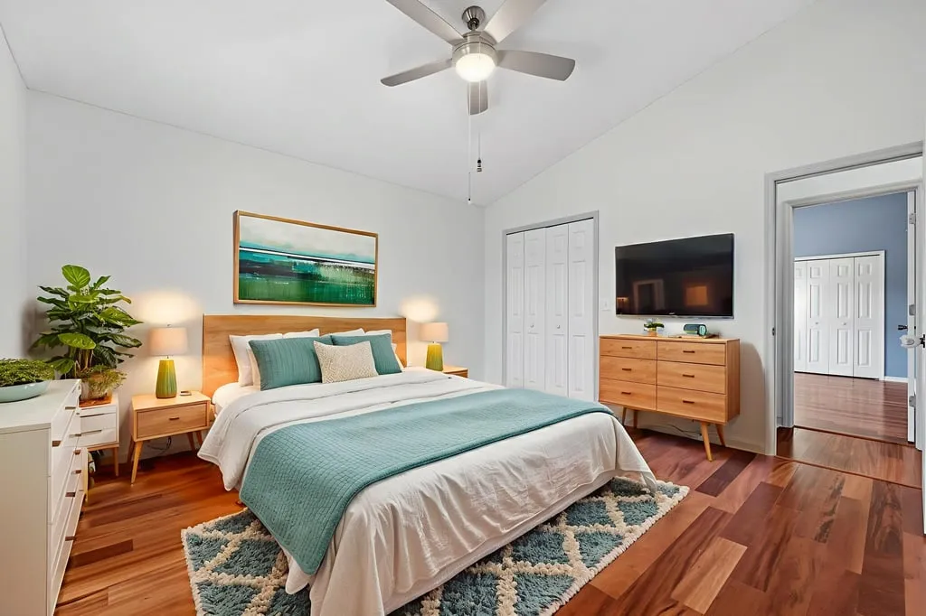 Bright, fully staged bedroom photographed by Aerial Shots Media in Odessa, Florida.