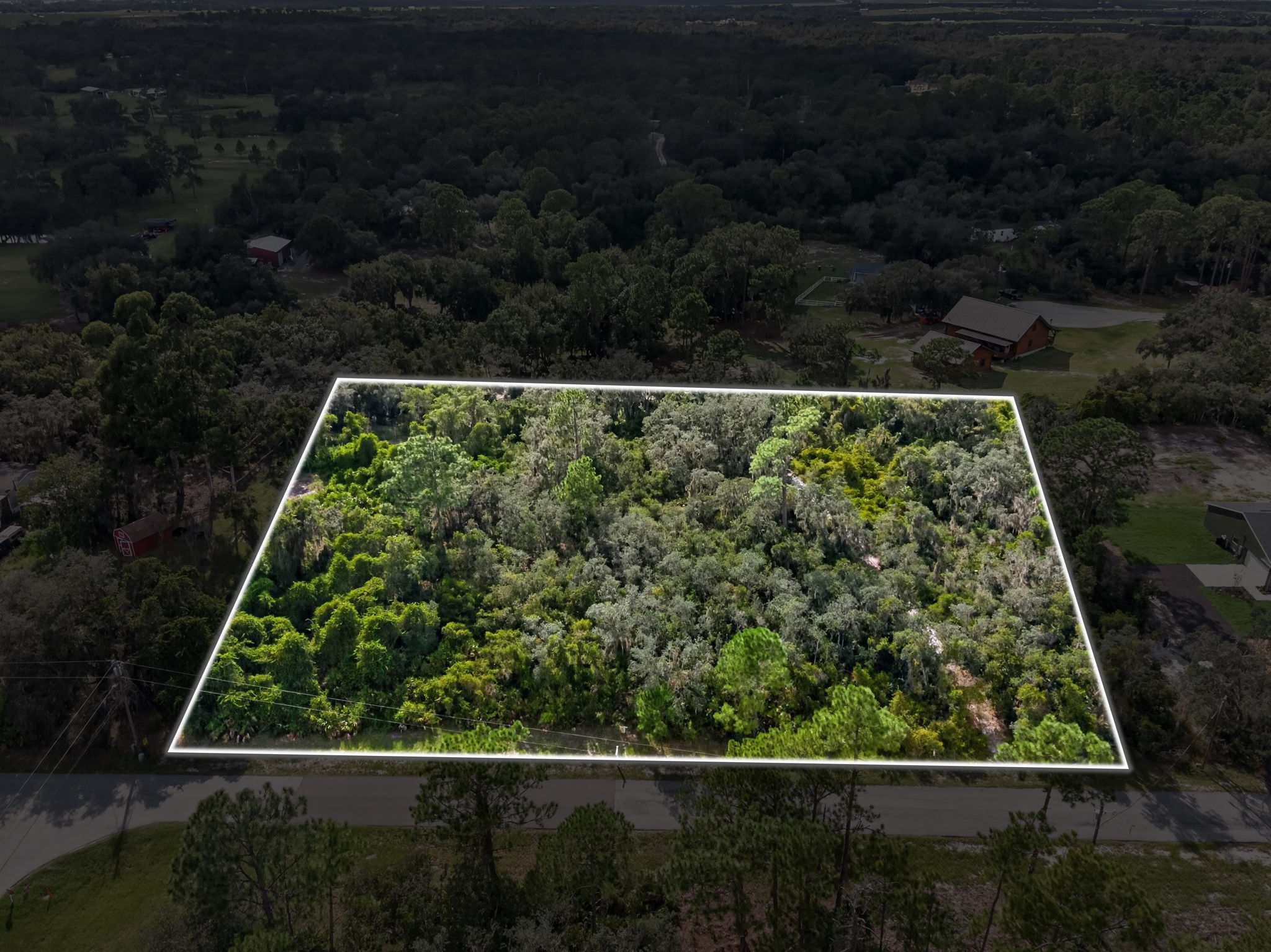 Aerial of a vacant lot with the lot lines drawn on